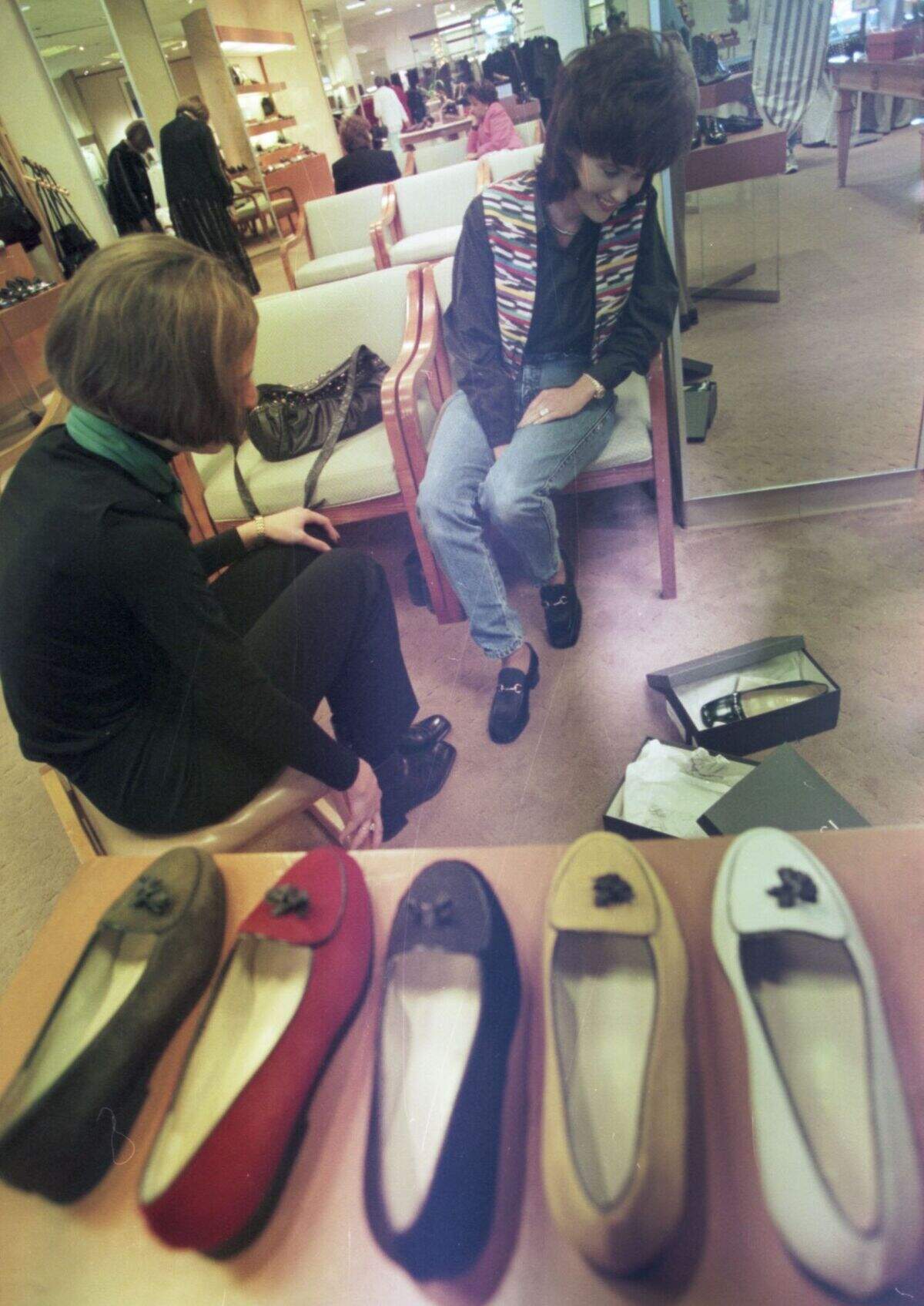 Terry Stevens tries on Gucci shoes at the Ridgmar Mall’s Neiman Marcus store in 1996.
